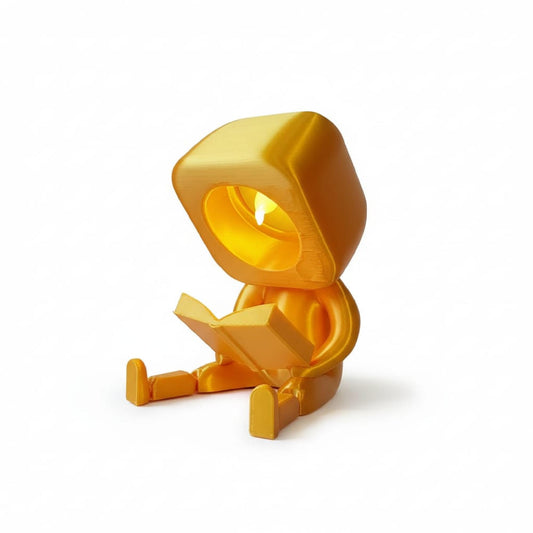 Enfeite Luminoso Articulado Personagem Lendo Livro Ideal para Decoração de Estantes e Mesas